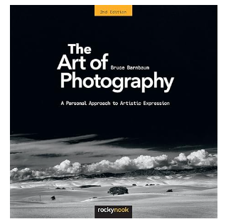 “Cover of ‘The Art of Photography: A Personal Approach to Artistic Expression’ by Bruce Barnbaum. The cover features a striking black-and-white photograph of a serene landscape, with a dramatic sky and a lone tree in the foreground. The title and author’s name are prominently displayed in elegant, bold typography.”